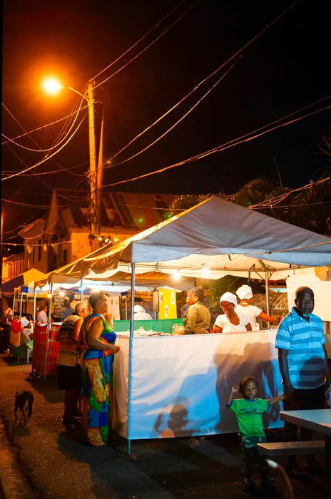 Food stalls lining the street during Fish Fry Friday in Grenada