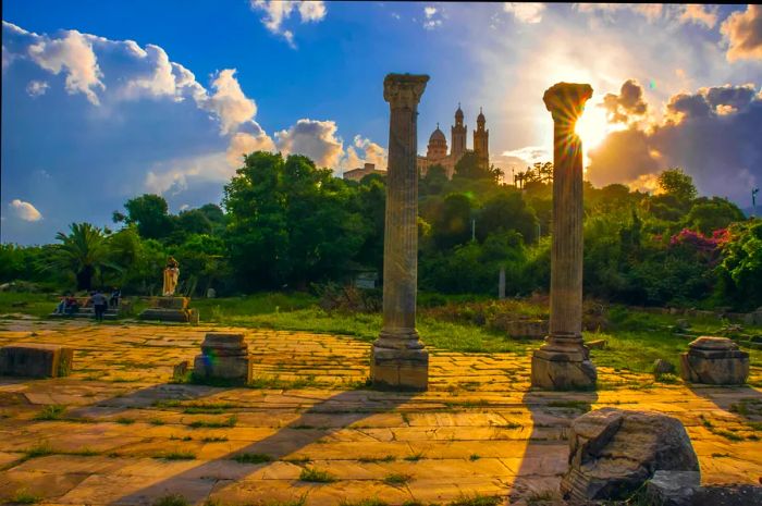 Roman ruins with the Church of St Augustine visible in the distance, Annaba, Algeria