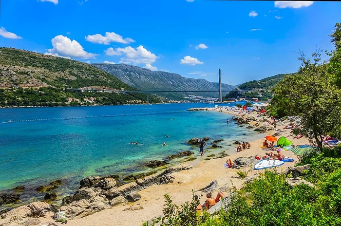 Sunbathers relaxing on Copacabana Beach in Dubrovnik