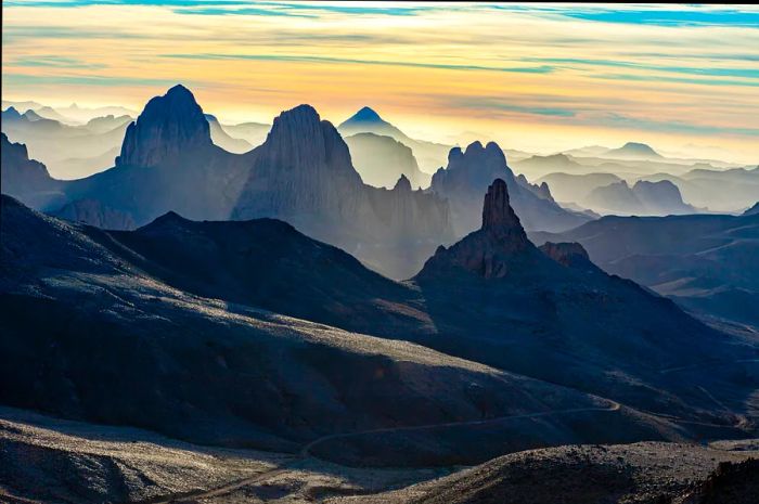 Basalt formations at sunrise in the Ahaggar Mountains, Ahaggar National Park, Algeria