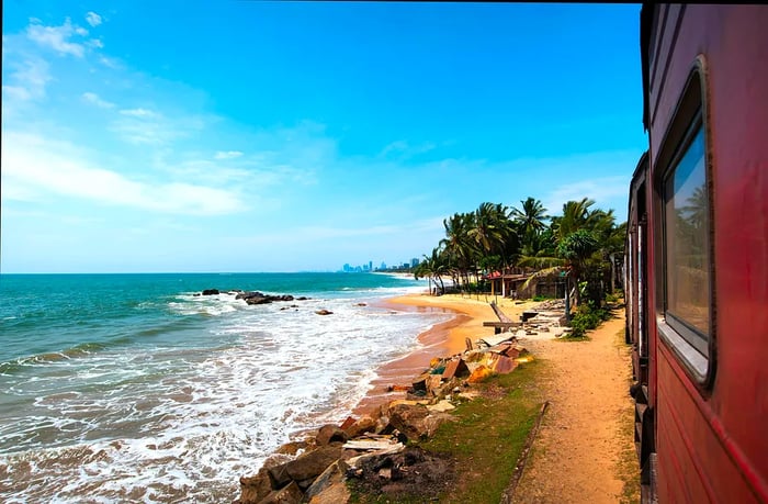 Scenic coastal train views in Sri Lanka