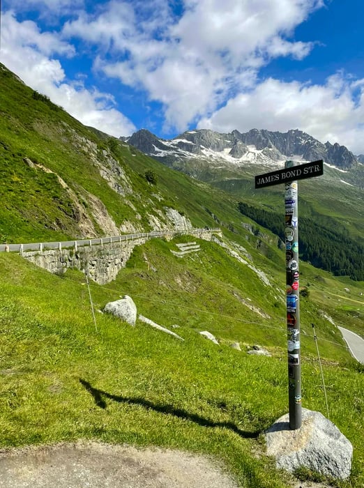 A road sign along a mountain pass indicates