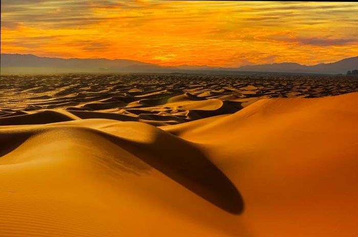 Dusk clouds over the sand dunes near Timimoun, Algeria