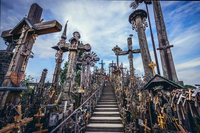 A wooden walkway meanders through countless crosses at the Hill of Crosses in Šiauliai, Lithuania