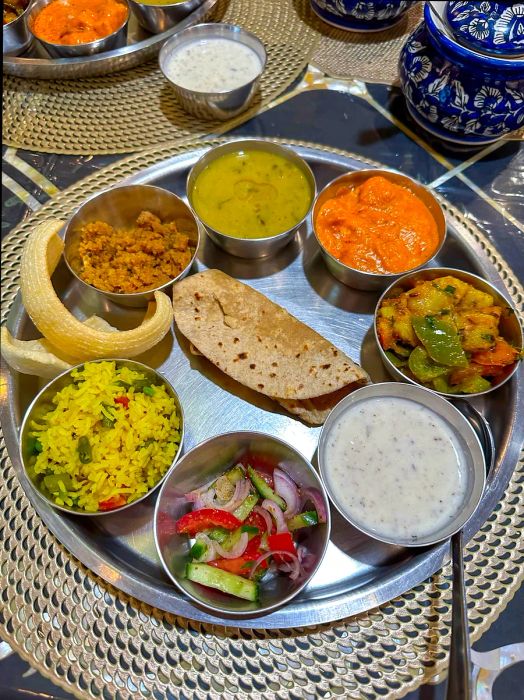 Indian thali meal. Experience Jaipur's culinary delights with a Rajasthani Thali