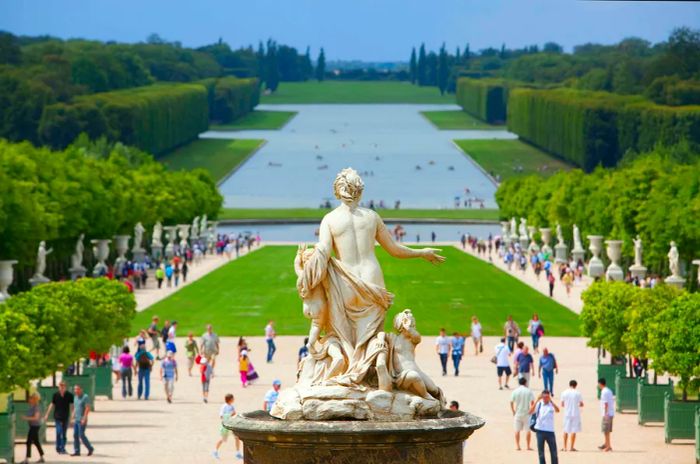 Versailles Palace — an expansive view of gardens bustling with tourists