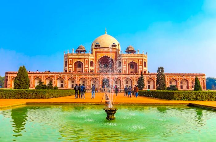 View of Humayun's Tomb featuring a small fountain in the foreground.