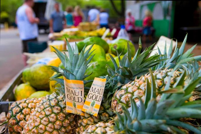 Pineapples available at a market stand