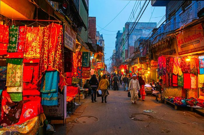 Evening scene at Chitli Qabar Bazar market street in New Delhi.