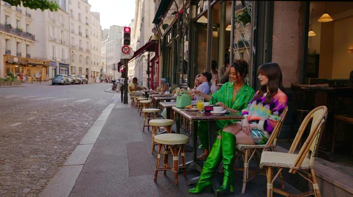 Two women enjoy coffee at outdoor café tables