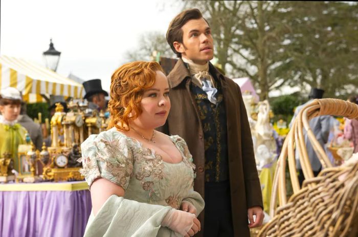 A woman and a man dressed in Georgian attire shop at a market