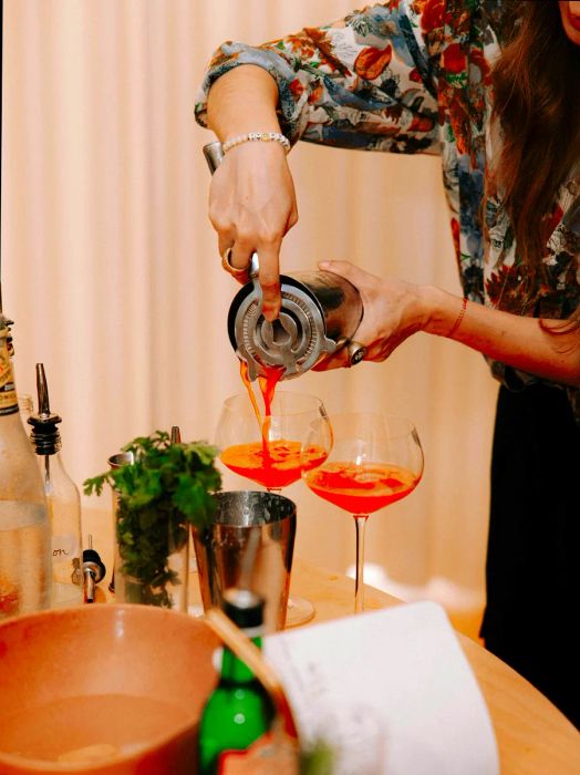 Listen-Bar-founder-making-the-She-Pretty-alcohol-free-cocktail-with-strawberry-rose-egg-white---photo-credit-Tomi-Cornio-for-Listen-Bar.jpg