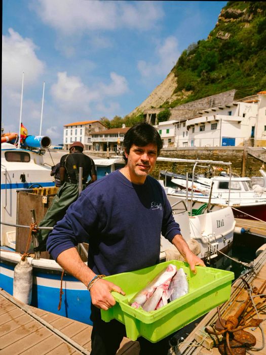 Fresh fish is being selected and prepared for grilling at Elkano in Getaria.