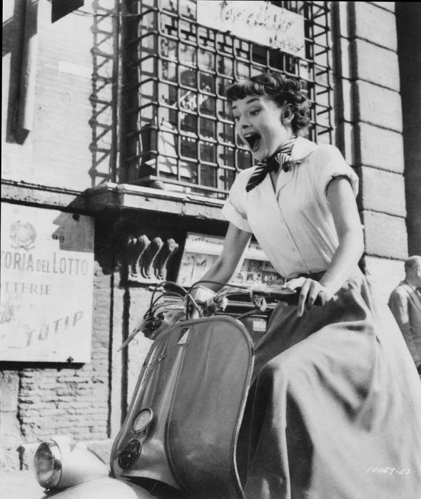 Belgian actress Audrey Hepburn (1929 - 1993) captured riding a scooter through Rome in a promotional still for 'Roman Holiday'