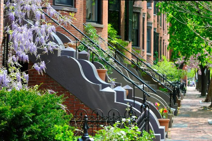 A walkway leading up to Victorian-style buildings