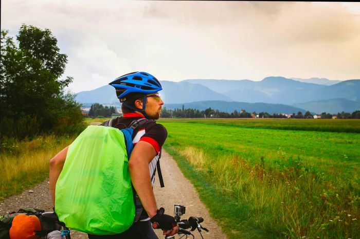 A cyclist pauses to admire the distant hills in Slovakia