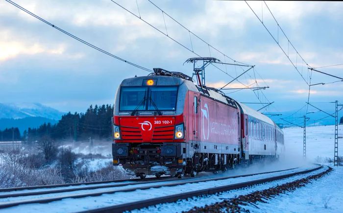 Express train service from Bratislava to Košice along a snowy route, Štrba, Slovakia