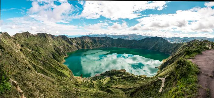 An aerial shot of the turquoise lake within the Quilotoa crater.