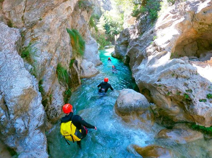 For an exhilarating natural adventure, consider canyoning through Spain's steep mountain passes.