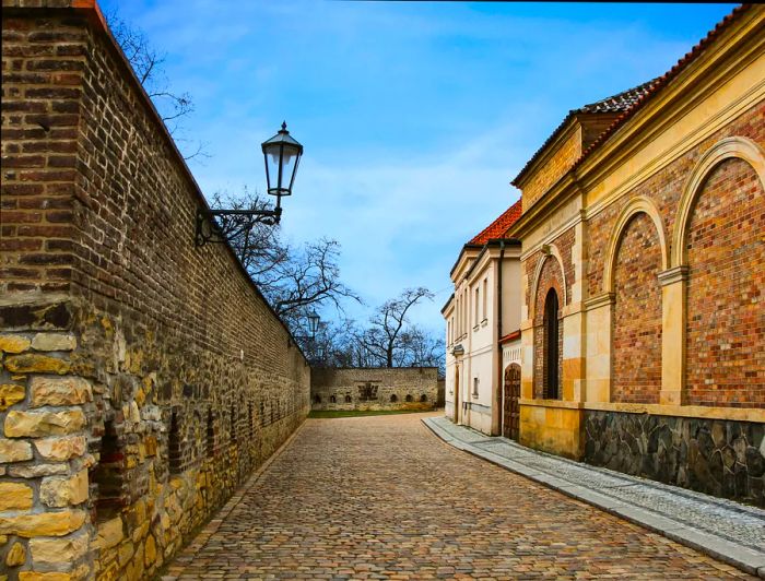 Historic street in Prague, Czech Republic, showcasing stone walls and cobblestones, Vyšehrad