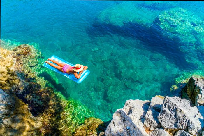 Women relaxing on a sunlit beach along the Turkish coast