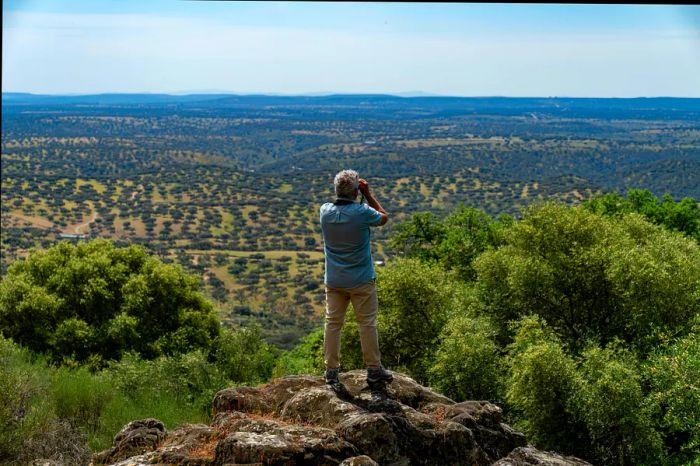 Raul Virosta, an ecologist and expert in birds, surveys a scenic view in Monfragüe.