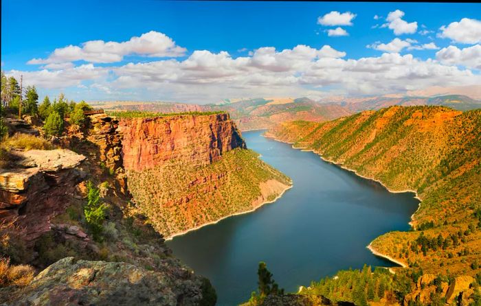 An aerial perspective of Green River Canyon, bordered by the striking red cliffs of Flaming Gorge National Monument in Wyoming