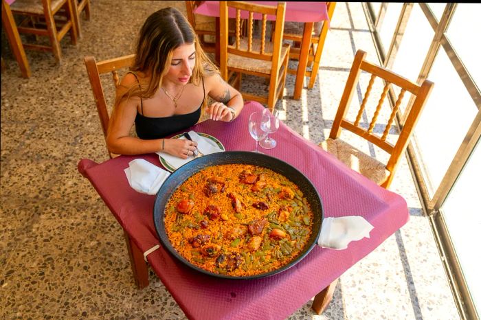 Savoring paella in Valencia.