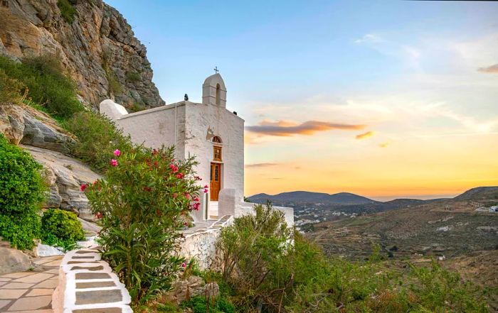 A Greek Orthodox chapel at sunset on Ano Syros, Cyclades, Greece