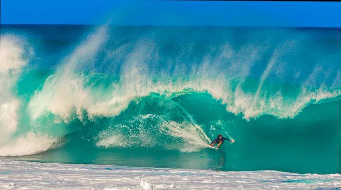 A surfer riding the waves