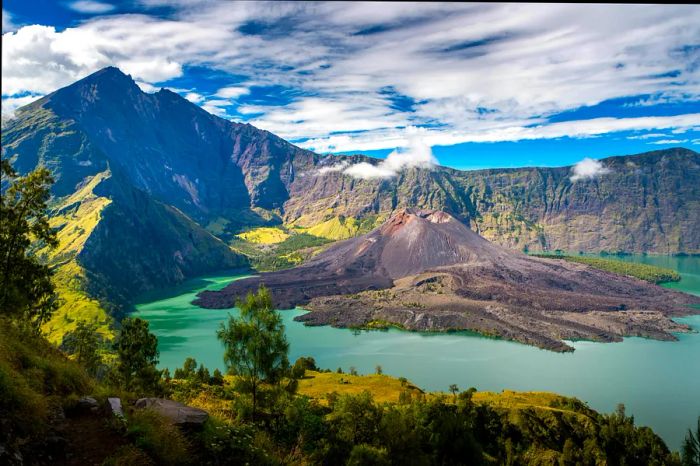 A volcanic crater lake with a volcanic peak at its center