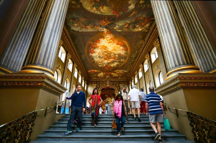 Visitors admire the Painted Hall in the Old Royal Naval College on July 22, 2015, in Greenwich, England.