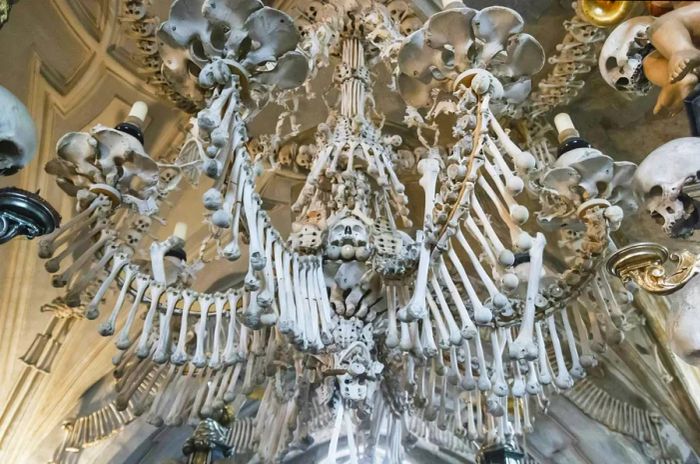 Interior decoration of the ossuary featuring human bones and skulls at the Kostnice Church in Kutná Hora, Czech Republic.