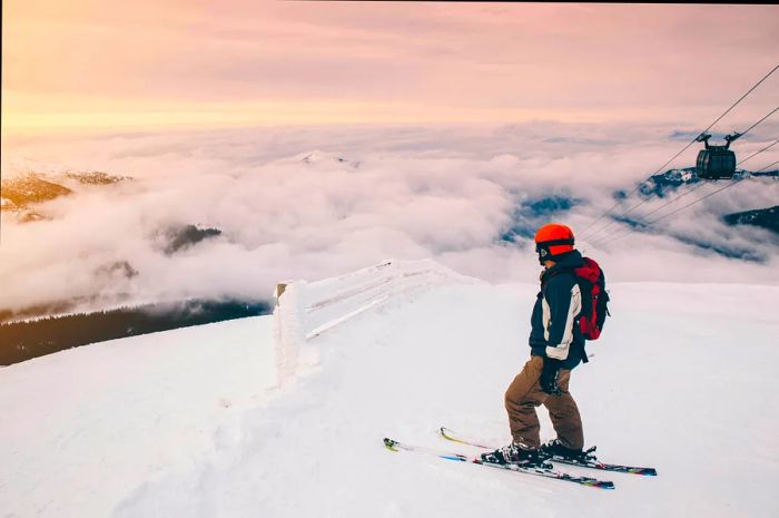 A skier navigates the slopes above the clouds at Chopok, Jasna, Slovakia.