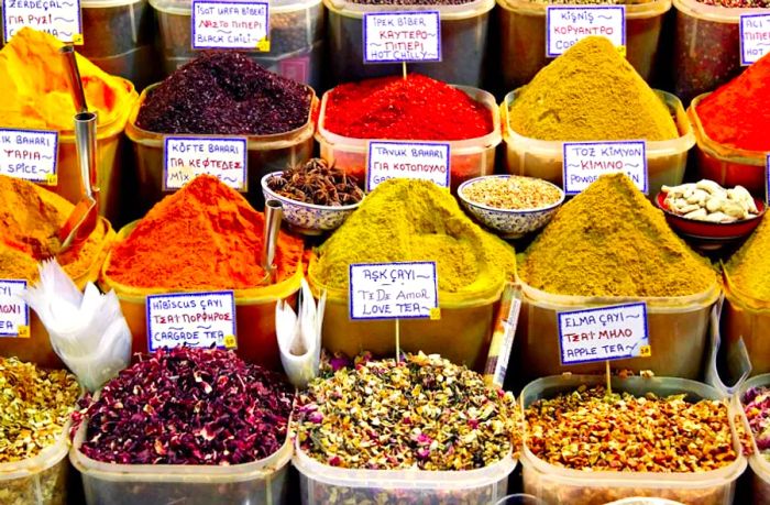 An array of containers filled with various spices at Istanbul's Spice Bazaar