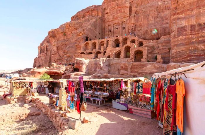 Local Bedouin manage shops situated in front of the Royal Tombs in Petra, Jordan.