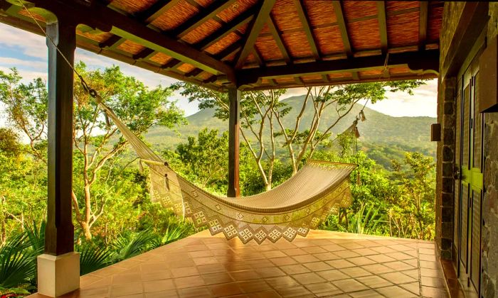 A hammock on a terrace overlooking the jungle at El Respiro in Nicaragua