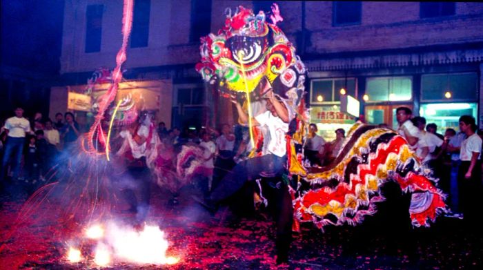 A performer in a dragon costume entertains at a New Year festival