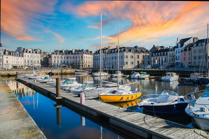 Sailboats illuminated by the dusk at the harbor in Vannes, Brittany, France