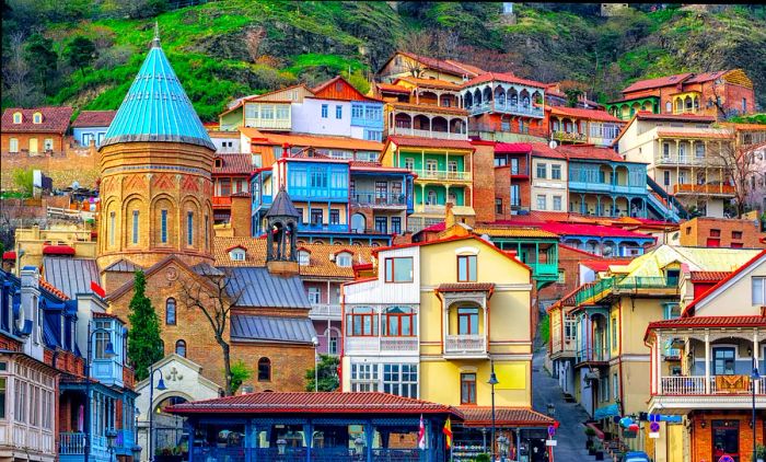 Charming traditional homes adorned with intricately carved balconies in Tbilisi's Old Town, Georgia