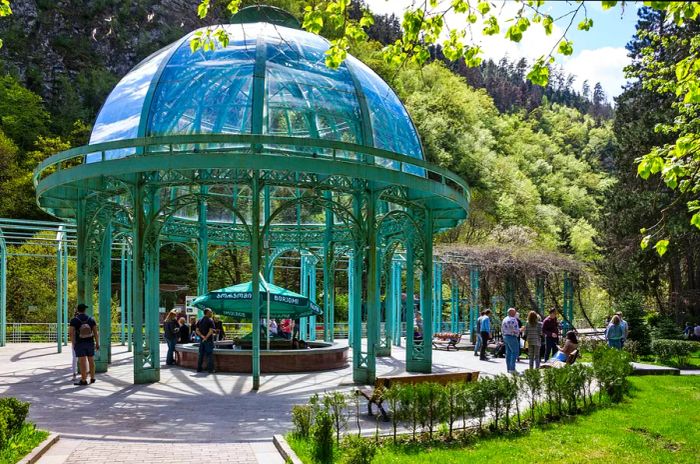 A light-blue pergola shelters a spring water fountain in the spa town of Borjomi, Georgia.