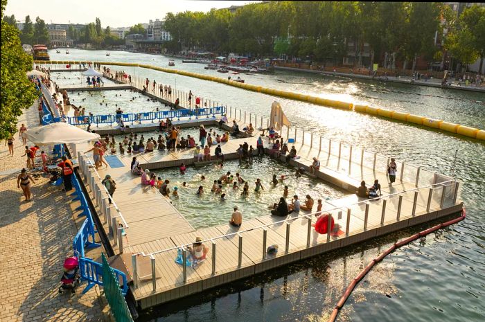 People swim and lounge on docks at Paris's largest artificial body of water.