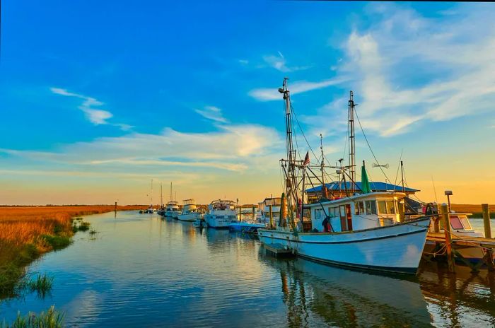 A sunset view featuring shrimp boats docked at Tybee Island, Ga.