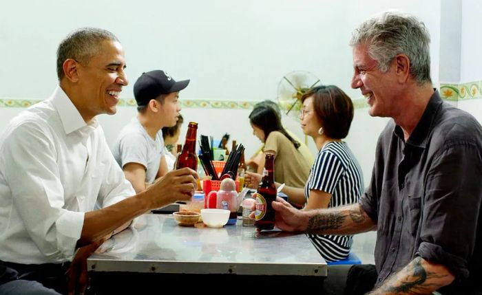 Barack Obama and Anthony Bourdain share a beer in Vietnam.