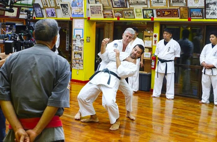 Anthony Bourdain trying his hand at tegumi wrestling in Okinawa, Japan.