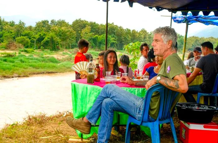 Anthony Bourdain relaxing by the riverside in Korea.