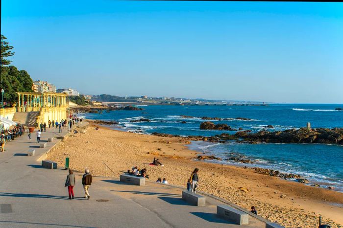 Strollers along a scenic path by the Atlantic Ocean, Porto, Portugal