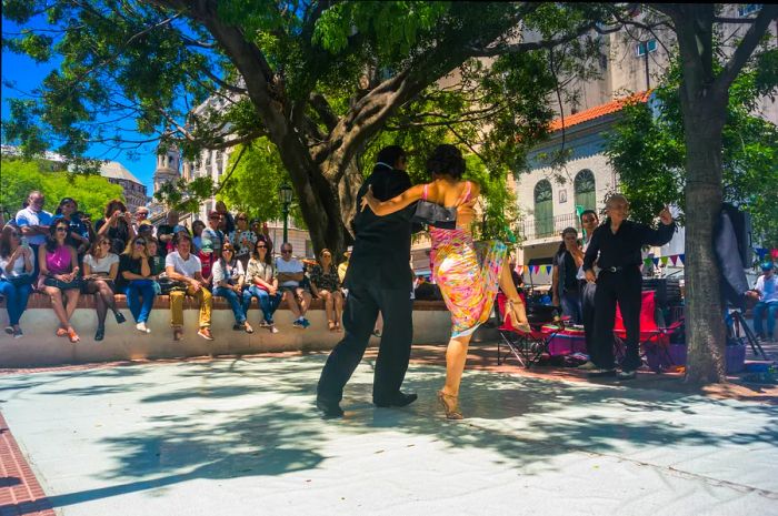 A couple performing tango in a street show in the San Telmo neighborhood.