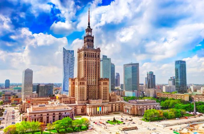 The grand 1950s Palace of Culture & Science is flanked by modern skyscrapers in Warsaw.