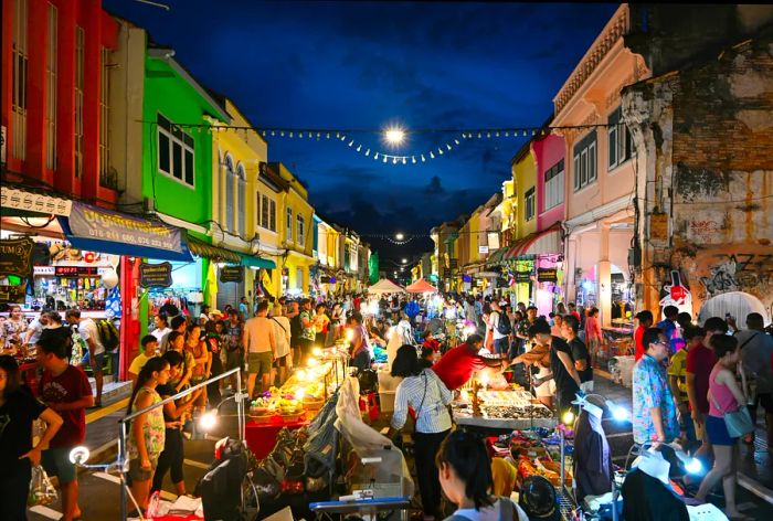 Numerous tourists stroll through Lard Yai at Phuket's weekend market, located in the old town area of Phuket, Thailand.